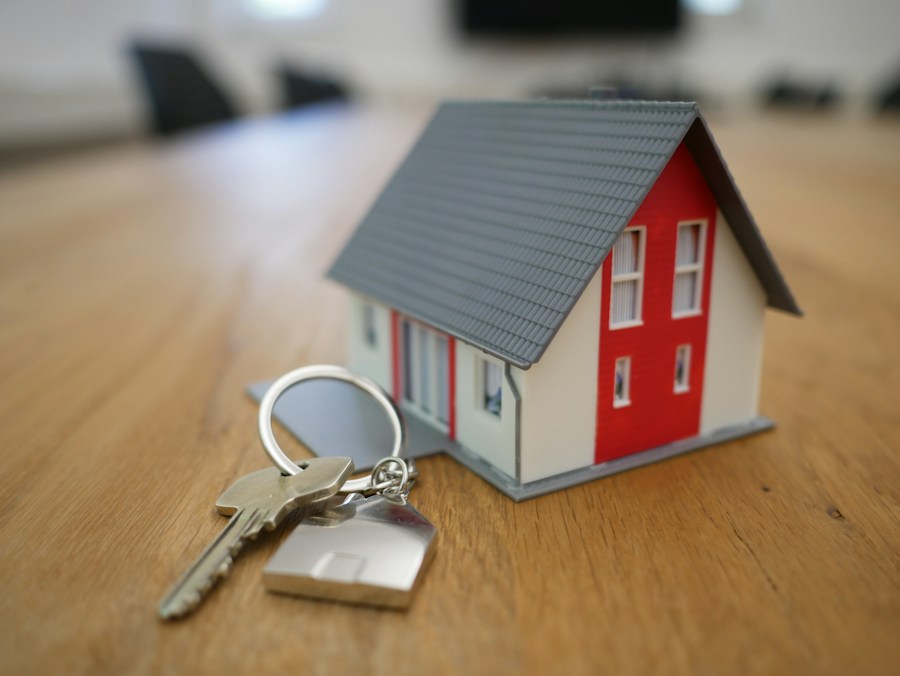 House model and keys representing home commitments