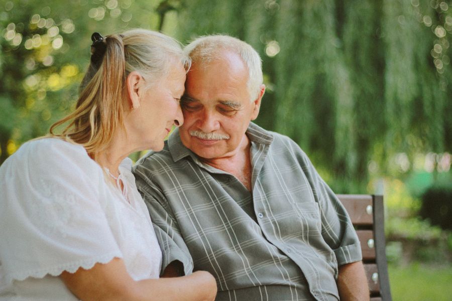 An older couple sharing a peaceful moment outdoors